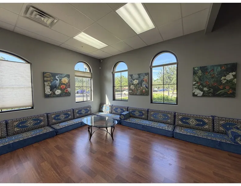 The large blue couch in the future library and tea lounge